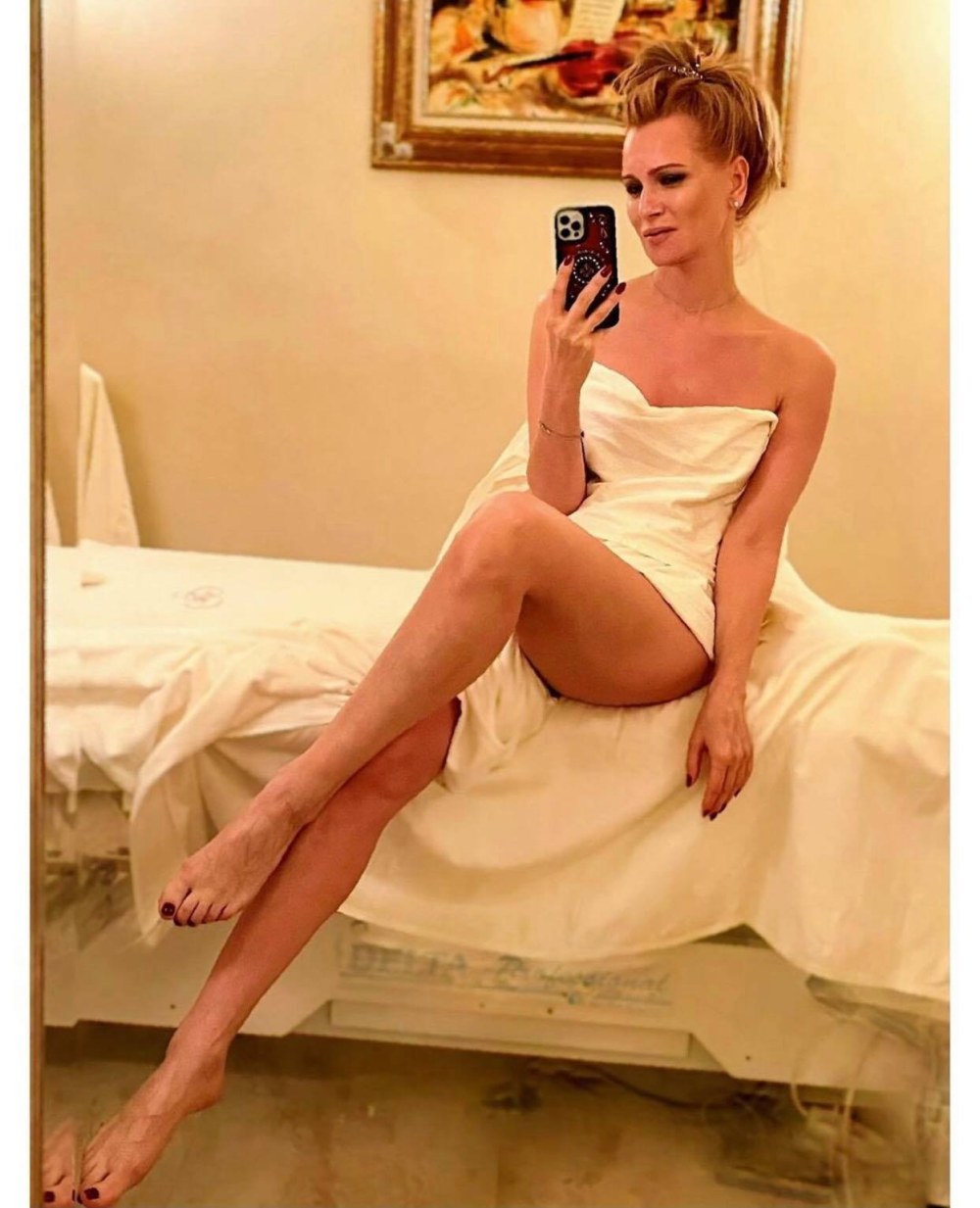 Les jambes Olesya Sudzilovskaya